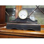 A slate and marble scrolled mantel clock with white enamel dial and Roman numerals, 15 3/4" wide
