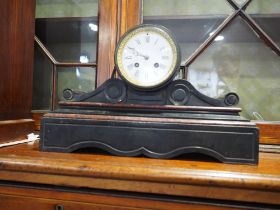 A slate and marble scrolled mantel clock with white enamel dial and Roman numerals, 15 3/4" wide