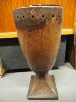 A West African carved hardwood Djembe drum, on square base (collected in the early 20th century), 30