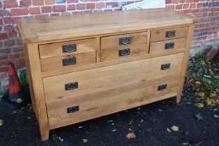 A modern oak custom-made sideboard, fitted six small drawers over two long drawers with ring