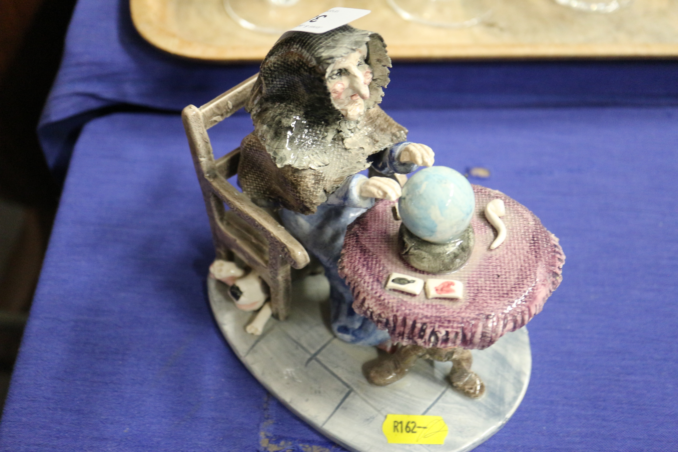 Seven Alan Young pottery figures and figure groups, including a witch, a man playing the piano, - Image 11 of 21