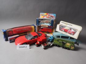 A collection of mostly boxed toy/model/collectors cars by Matchbox, Corgi, Dinky and others