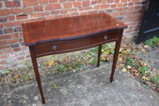 A mahogany and banded serpentine side table, fitted two drawers, 33" wide x 18" deep x 30 1/2"