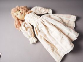 A felt faced doll, dressed in period costume, signed and numbered, Linda Murray, 25 1/2" high