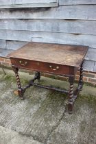 A 19th century provincial oak side table, fitted one long drawer, on twist turned and stretchered