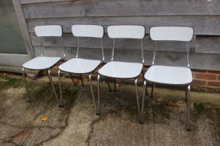 A set of four 1960's chrome and grey and white striped laminate kitchen chairs