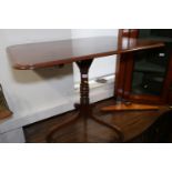 A 19th century mahogany rectangular top occasional table, on turned column and tripod scroll