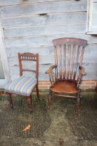 A Windsor lath back elbow chair and a walnut side chair