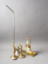 A pair of brass candlesticks, on square bases, 6" high, a crumb scoop and brush, and an "opium" pipe