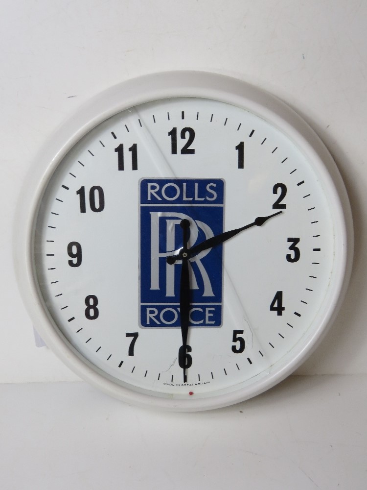 A c1960s Smiths 12" dial wall clock having Rolls Royce motif upon and later fitted quartz movement.