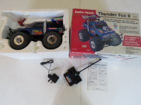 A Radio Shack Thunder Fox II radio controlled off road 4 x 4 truck in original box.