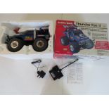 A Radio Shack Thunder Fox II radio controlled off road 4 x 4 truck in original box.