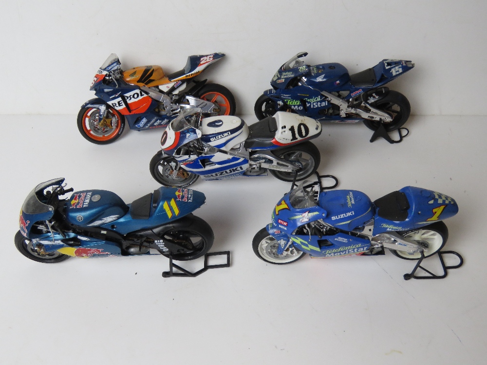 A quantity of five scale model racing bikes inc Suzuki, Honda and Yamaha.