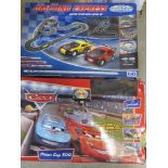 Two slot car racing sets being Disney Pixar Cars and Drifting Express in play worn condition.