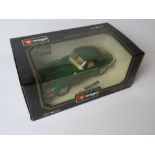 A Burago Jaguar E Coupe (1961), diecast metal, 1/18 scale, in original packaging.