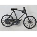 A decorative model of a bicycle having kick stand, working handle bars and turning wheels,