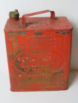 A vintage red painted Esso can, with brass cap, measuring approx 25cm wide.