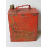 A vintage red painted Esso can, with brass cap, measuring approx 25cm wide.