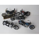 A set of five scale model vintage motorbikes inc Yamaha and Honda.