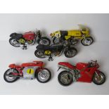 A quantity of larger scale model vintage motorbikes including Norton, AJS, MV Augusta and Ducatti.
