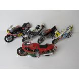 A set of five scale model racing motorbikes including Honda, Suzuki, Yamaha and Ducatti.