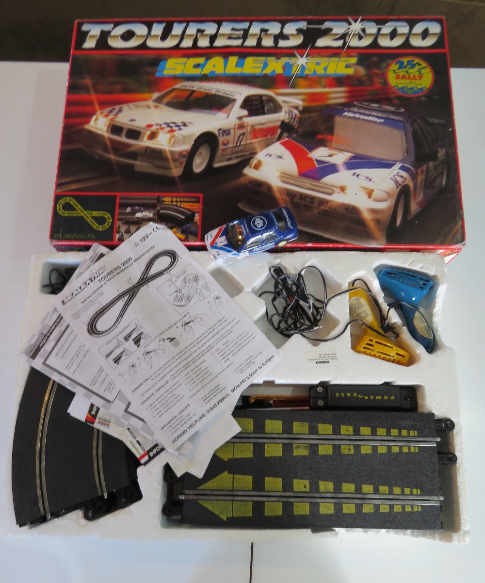 Scalextric Tourers 2000 race track with one rally car a/f and two controllers.