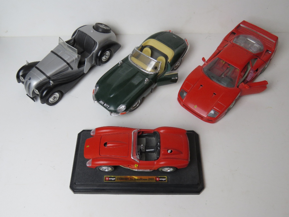 Four scale model vehicles being a BMW 328,