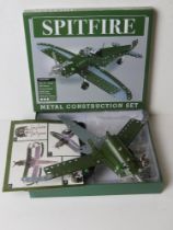 A part-built Meccano type metal construction set of a Spitfire, in unchecked condition.