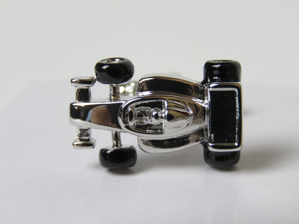 A pair of as new cufflinks in the form of F1 racing cars with black enamel wheels by Onyx-Art in - Image 2 of 2
