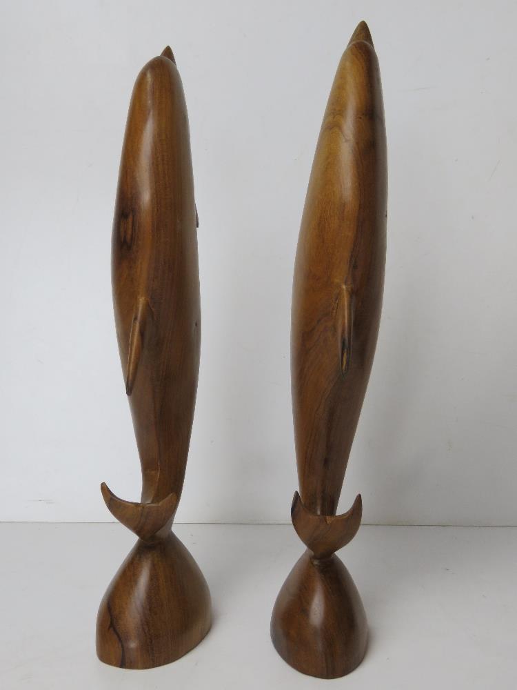 A pair of carved wooden dolphin figurines, one having repair to dorsal fin, each standing 37cm high. - Image 5 of 5