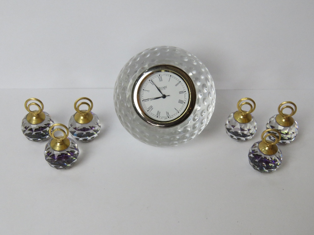 A Stuart Crystal golf ball themed clock together with six crystal place card holders.