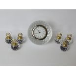 A Stuart Crystal golf ball themed clock together with six crystal place card holders.
