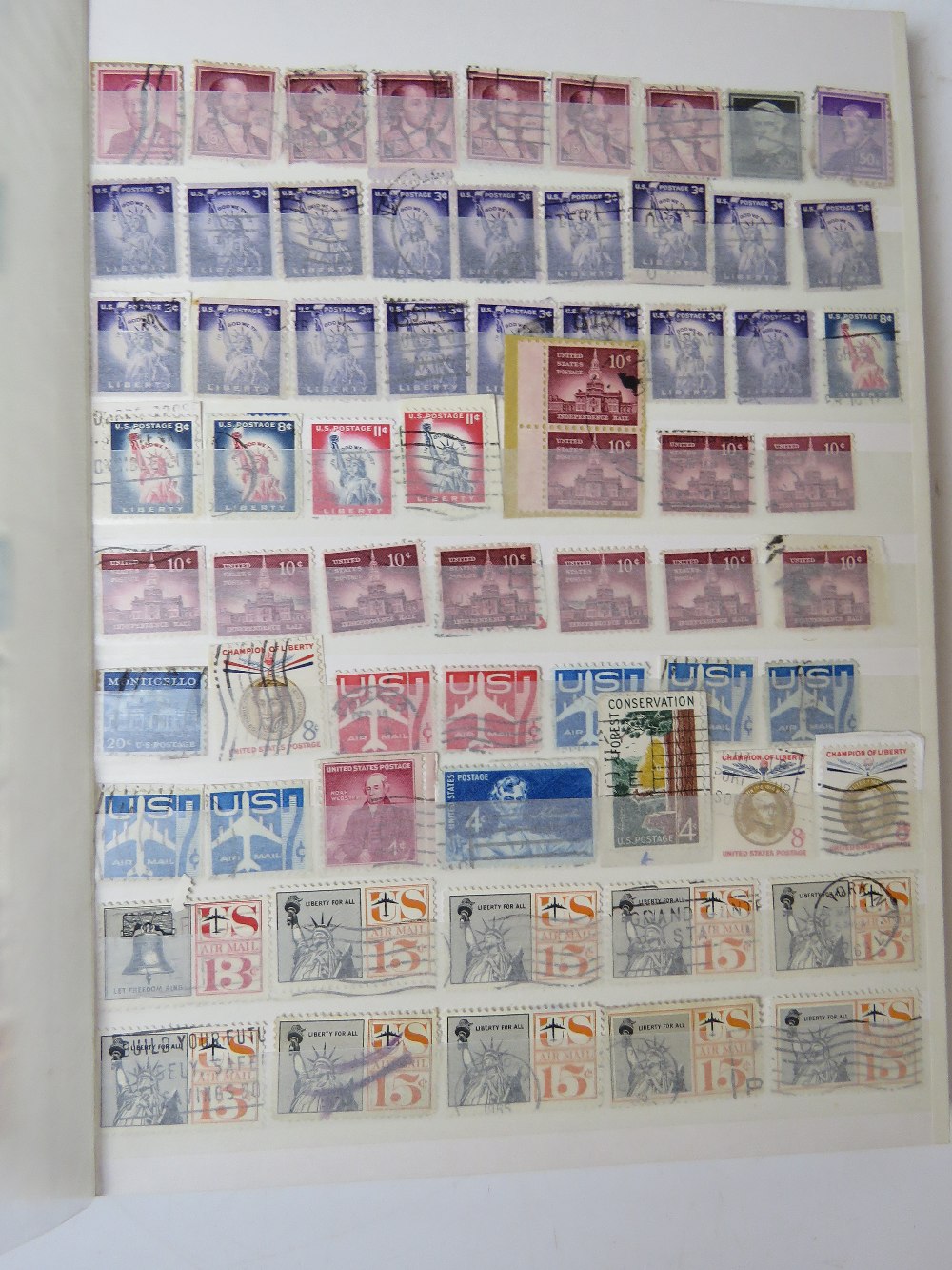 A collection of 20th century World Stamps in seven albums includes Ceylon and Rhodesia.