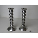 A pair of chrome bobbin turned style candlesticks.