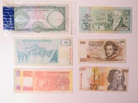 A collection of assorted world paper bank notes including; Peru, Oman, Slovenia, Italy, Guernsey,