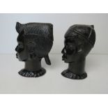 A pair of African carved heads being male and female, each approx 17cm high.