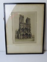 A signed print of a W Watson sketch of Notre Dame, framed and glazed.