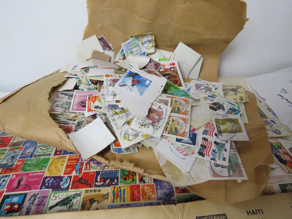 A quantity of assorted loose stamps together with some stuck down stamps and part used albums. - Image 5 of 5