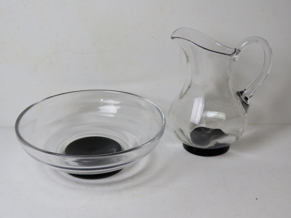 An Orrefors Swedish Glass fruit bowl, signed to base, with matching water jug, unsigned.