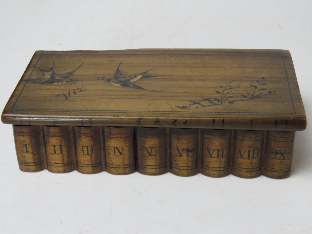 A handmade puzzle type box having hidden front slide release for lid decorated with swallows upon,