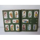 A Cigarette card album having assorted sets and part sets within.