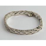 A heavy biker style articulated bracelet, stamped 925, 42.4g.