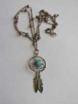 A Native American style dreamcatcher pendant on chain,