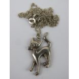 A 925 silver chain having white metal cat pendant upon.