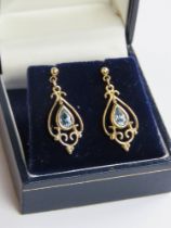 A pair of 9ct gold and aquamarine earrings stamped 375 to the butterfly backs, 1.