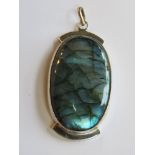 A large labradorite pendant in white metal approx 6.3cm in length.