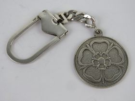 A HM silver key chain having Tudor Rose design upon, 26.3g.