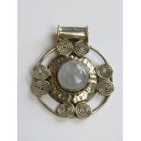 A large 925 silver and moonstone pendant stamped 925,
