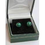 A pair of malachite stud earrings in presentation box.