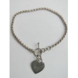 A 925 silver bracelet with heart tag upon, T-bar clasp, approx 19cm in length.